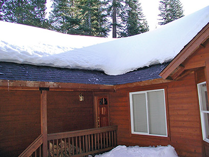A roof de-icing system installed under shingles along roof eaves.